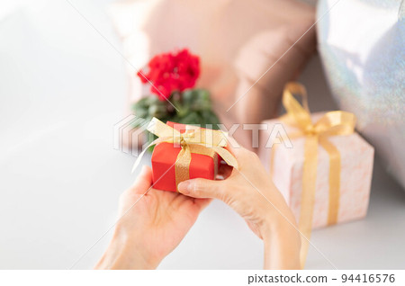 A woman with a present 94416576