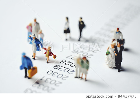 Miniature people walking beside chronology Miniature people walking beside chronology 94417473