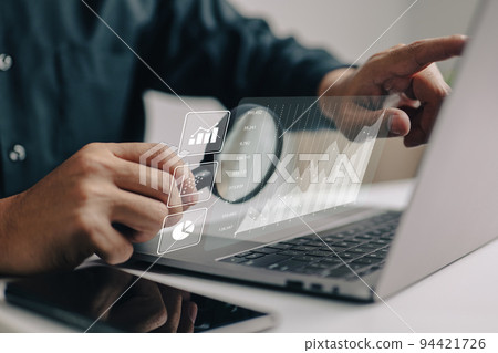 The analyses of large amounts of data and the idea of business intelligence. Charts of the company finances are displayed on a screen that is simulated. 94421726