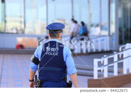 Police officers patrolling the airport Back view Security Metropolitan Police Department 94422671