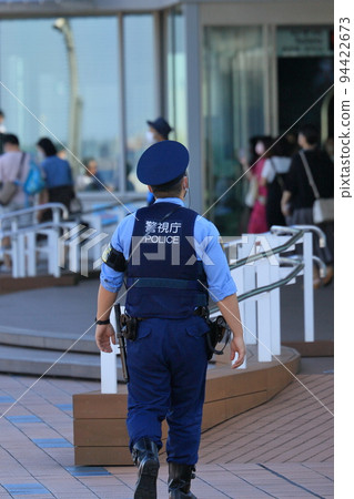 Police officers patrolling the airport Back view Security Metropolitan Police Department 94422673