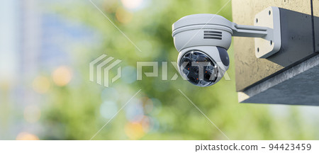 CCTV camera installed on wall of the building or office. Scan the area for surveillance purposes. 94423459