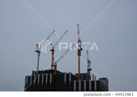 Construction of skyscrapers in a big city. The redevelopment of the city center knows no bounds. Taken in Umeda, Osaka Construction of skyscrapers in a big city. The redevelopment of the city center knows no bounds. Taken in Umeda, Osaka 94423961