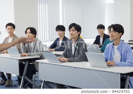 Men and women attending a seminar Men and women attending a seminar 94424781