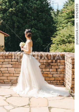 A woman in a white dress A woman in a white dress 94426699