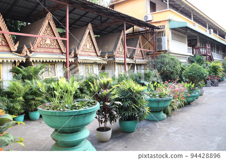 Decorative pavilion and tropical plants in pots, garden of Royal Palace complex, Phnom Penh, Cambodia Decorative pavilion and tropical plants in pots, garden of Royal Palace complex, Phnom Penh, Cambodia 94428896