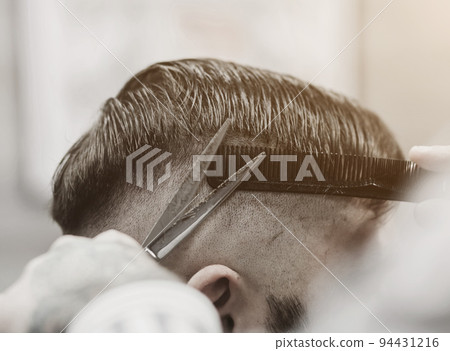 Barber with scissors and a comb Barber with scissors and a comb 94431216