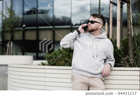 man is talking on a smartphone. man is talking on a smartphone. 94431217