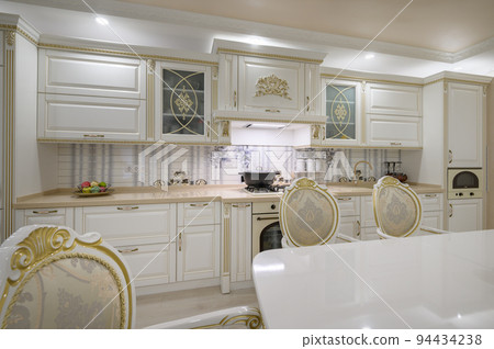 Renovated Interior of rich classic white kitchen 94434238