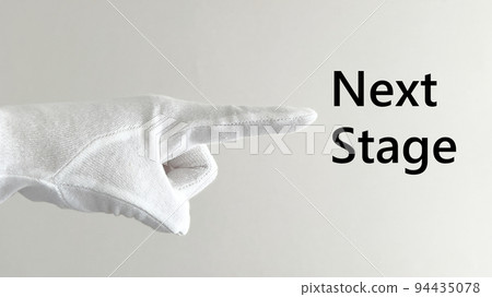 White glove index finger and NextStage characters _ sideways _ white wall background _ wide 94435078