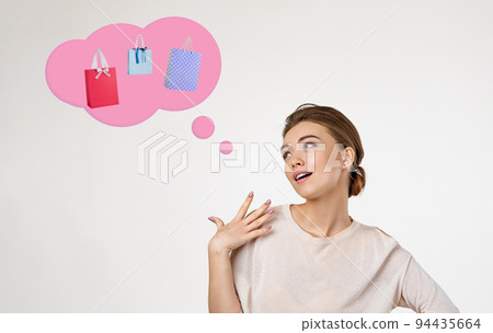beautiful young woman thinks about shopping beautiful young woman thinks about shopping 94435664