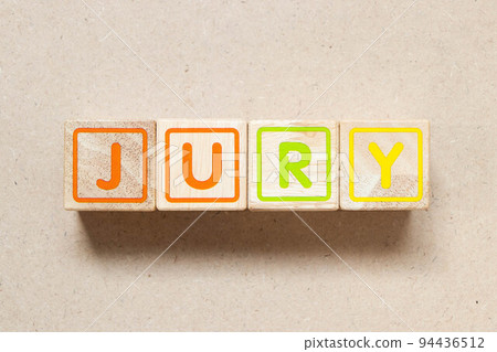 Color letter block in word jury on wood background 94436512