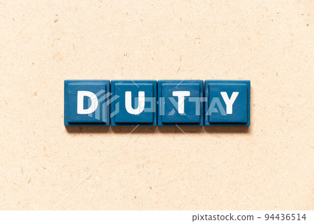 Tile letter in english word duty on wood background Tile letter in english word duty on wood background 94436514