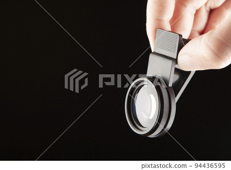 image of lens hand dark background image of lens hand dark background 94436595