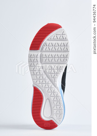 Trendy fashionable sneakers with sole on white background. Stylish sports casual shoes. Creative minimalistic layout with footwear Trendy fashionable sneakers with sole on white background. Stylish sports casual shoes. Creative minimalistic layout with footwear 94436774