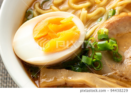Boiled egg in ramen. 94438229