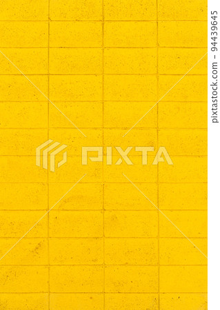 yellow block wall background material 94439645