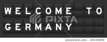 Black color analog flip board with word welcome to germany on gray background Black color analog flip board with word welcome to germany on gray background 94439699