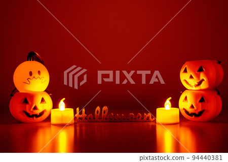 Halloween figurines with candle lit jack-o-lanterns and ghosts Halloween figurines with candle lit jack-o-lanterns and ghosts 94440381