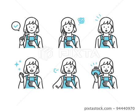 A housewife in a simple touch apron who is operating a smartphone 94440970