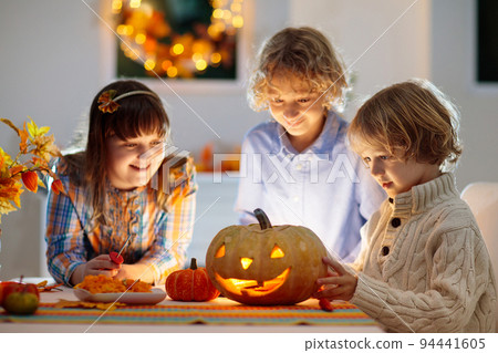 Family carving pumpkin for Halloween Family carving pumpkin for Halloween 94441605