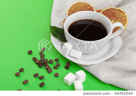 Cup of coffee on green background. Cup of coffee on green background. 94442040