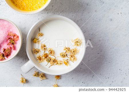 Chamomile moon milk in white cup. Ayurveda drink, chamomile latte tea. Chamomile moon milk in white cup. Ayurveda drink, chamomile latte tea. 94442925