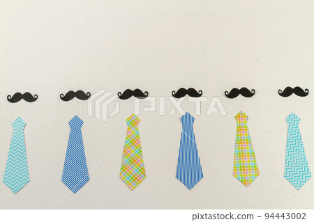 Mens neckties and moustaches on white surface. Fathers day concept. 94443002