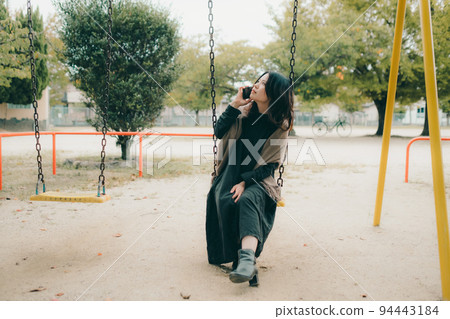 A woman in a park A woman in a park 94443184