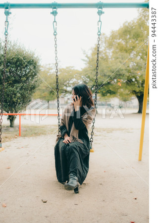 A woman in a park 94443387
