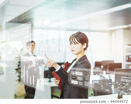 A woman who operates a tablet 94444972