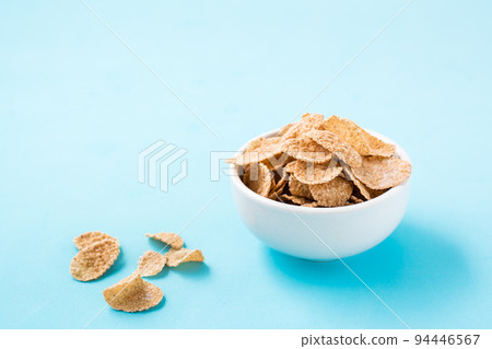 Cereal breakfast cereal dry breakfast in a bowl on a blue background 94446567