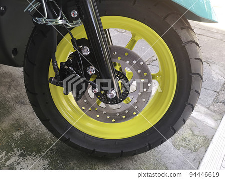 Close-up of motorcycle brakes and front wheel 94446619