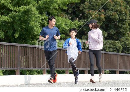 Family enjoying jogging outdoors Family exercise image 94446755