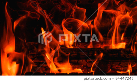 Fire. Fire texture. Burning wood in the fireplace. Close-Up Of Fire In The Dark. Fire flames burning isolated on black background. Fire. Fire texture. Burning wood in the fireplace. Close-Up Of Fire In The Dark. Fire flames burning isolated on black background. 94447245