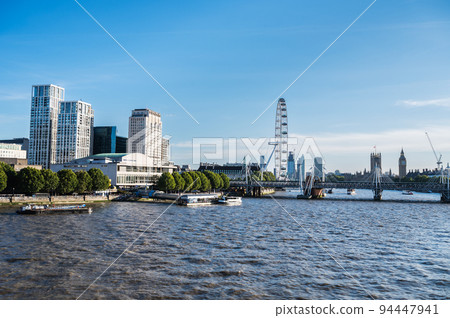 View of London Eye from Waterloo bridge. Westminster Palace view 94447941