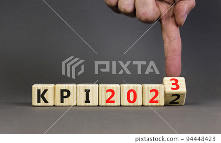 KPI, key performance indicator symbol. Businessman turns wooden cubes with words KPI 2022 and KPI 2023 on beautiful grey background, copy space. Business KPI key performance indicator concept. KPI, key performance indicator symbol. Businessman turns wooden cubes with words KPI 2022 and KPI 2023 on beautiful grey background, copy space. Business KPI key performance indicator concept. 94448423