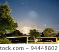 dazzling moon floating in the night sky 94448802
