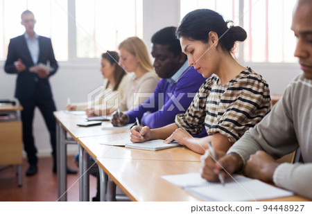 Woman in group of students in university audience 94448927