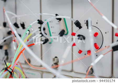 Close up of liquid phase chromatography system, tubes and hoses 94450174