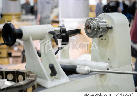 Close up view of wood turning lathe machine at workshop Close up view of wood turning lathe machine at workshop 94450184