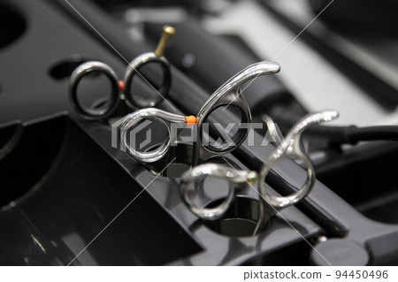 A set of scissors for cutting hair. A set of scissors for cutting hair. 94450496