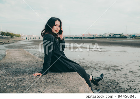woman standing on the riverbed woman standing on the riverbed 94450843