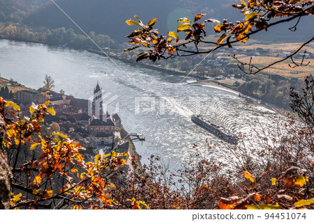 Duernstein village with church against ship on Danube river during autumn, Wachau in Austria, UNESCO Duernstein village with church against ship on Danube river during autumn, Wachau in Austria, UNESCO 94451074