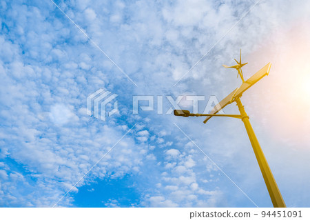 Renewable energy sources. Wind turbine with solar energy power panel, renewable photovoltaic technology. Alternative energy concept. 94451091