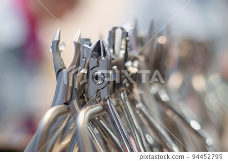 Different types of hard wire dental cutters and scissors - close up Different types of hard wire dental cutters and scissors - close up 94452795