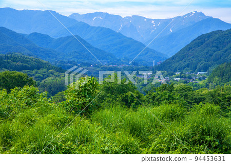 Satoyama scenery near Minakami-machi, overlooking the Tanigawa mountain range, early summer season Satoyama scenery near Minakami-machi, overlooking the Tanigawa mountain range, early summer season 94453631