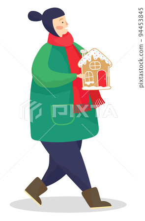 Kid Carrying Gingerbread Cookie in Form of House Kid Carrying Gingerbread Cookie in Form of House 94453845