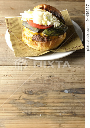 Avocado cheeseburger on a paper napkin Avocado cheeseburger on a paper napkin 94456227