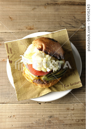 Avocado cheeseburger on a paper napkin 94456243